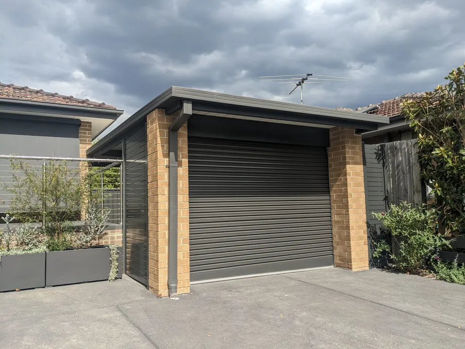 Roller door fitted to a carport